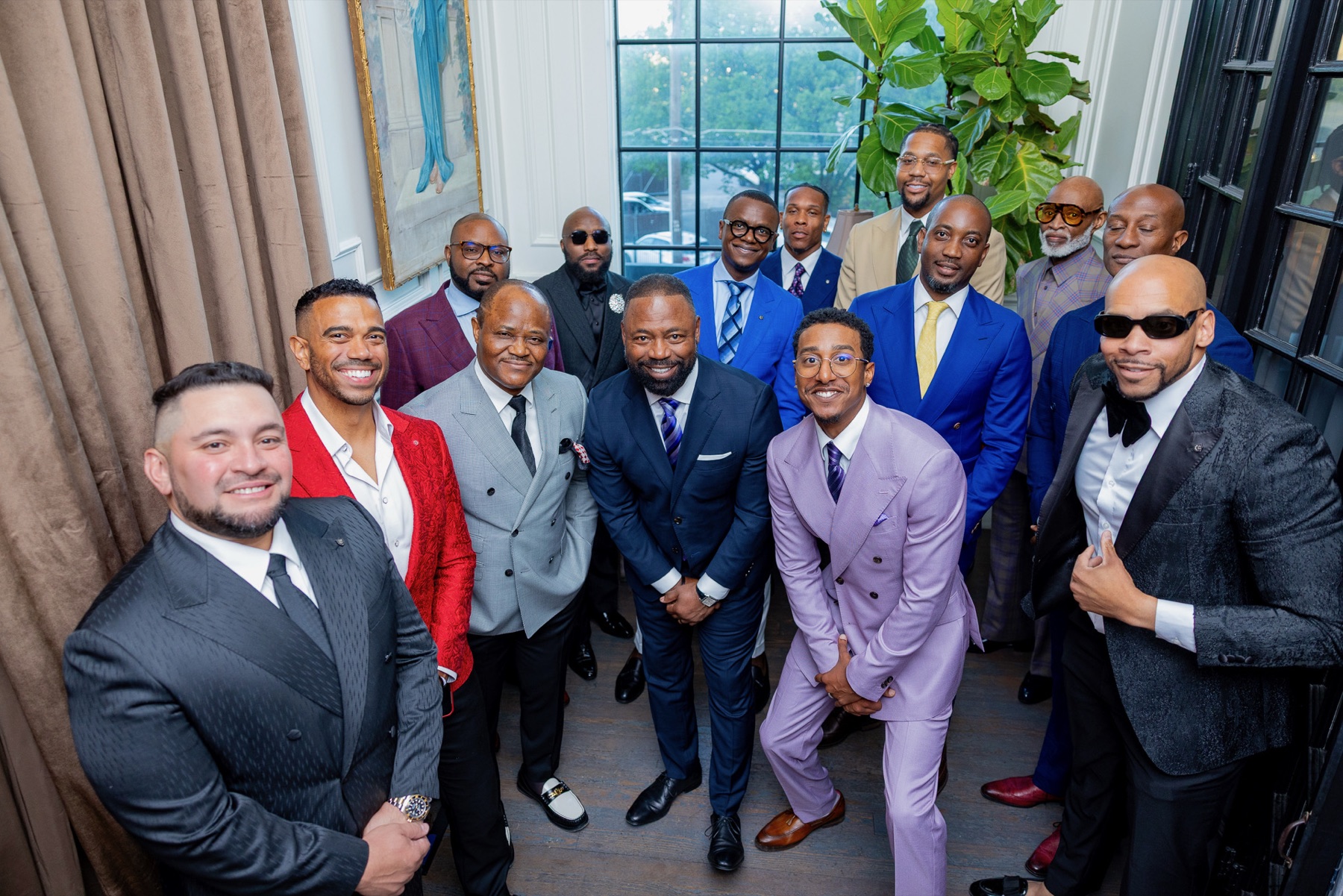 A sharp-suited crew gathered at a formal event